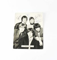 ROLLING STONES; a black and white promotional photograph multi-signed front and verso, Mick