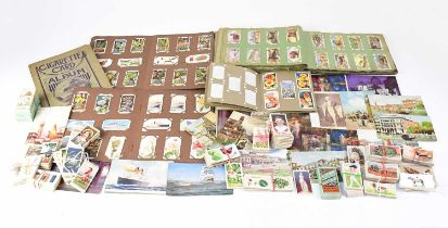 A collection of cigarette cards, both loose and in five albums, together with a small quantity of