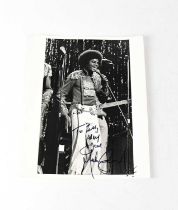 MICHAEL JACKSON; a black and white promotional photograph of the young Michael Jackson, signed and