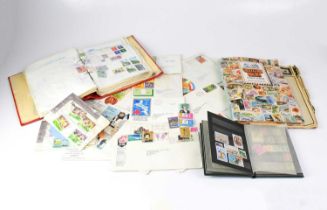 A collection of UK and world stamps in three albums, together with some loose examples.