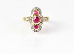 A 9ct yellow gold navette ring, set with three rubies in a surround of diamonds, with diamonds set