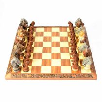 GALA STAR CC; a hand painted chess set, with each of the figures in the form of an animal, with