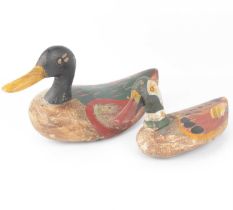 Two vintage painted wooden decoy ducks, lengths 26cm and 33cm, height of largest 17cm (2). Condition