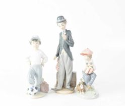 LLADRÓ; three figures, comprising Charlie Chaplin, a boy with his foot resting on a football and a