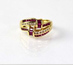 An 18ct gold ring set with rubies and diamonds, in a ribbon-type design, stamped '18K', size M,