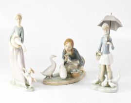 LLADRÓ; three figure groups of young ladies with ducks, height of largest 28cm (3). Condition