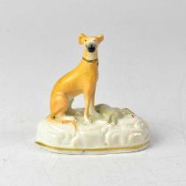 A 19th century Staffordshire model of a seated greyhound with a dead hare at its feet, on a Rococo-