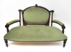 An Edwardian mahogany part parlour suite comprising a settee and four single chairs upholstered in