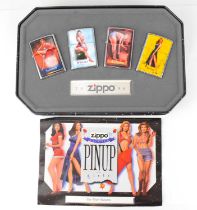 ZIPPO; a pin-up girls 'The Four Seasons' collectors' tin with outer sleeve, comprising four litho