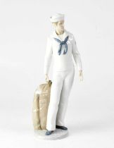 LLADRÓ; a boxed figure of a sailor, on round base, stamped verso '6654' and 'B22DY', height 34cm.