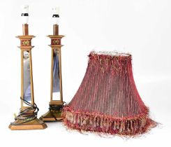 A pair of mirrored and painted wooden table lamps, with beaded fringed burgundy shades, height of