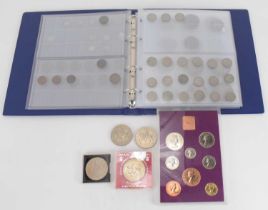 A coin album containing mostly British coins, to include 1895 and 1889 silver crowns, two 1890