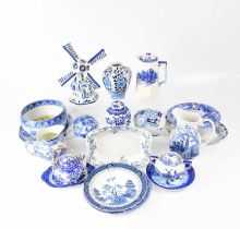 A quantity of blue and white ware, including plates, jugs, a windmill ornament, ginger jars, etc,