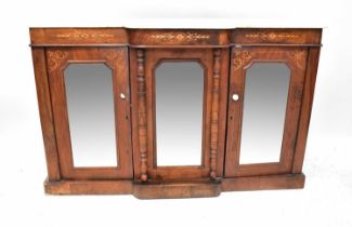A Victorian rosewood breakfront marble top credenza with three mirrored doors, on a plinth base,