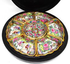 An early 20th century Chinese set of porcelain sweetmeat dishes, each decorated in the Canton
