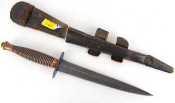FAIRBAIRN-SYKES; a commando fighting knife with ribbed copper tone handle, hilt impressed '...
