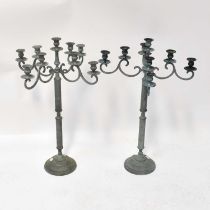 A pair of contemporary spelter four-branch candelabra with verdigris-effect finish and scroll
