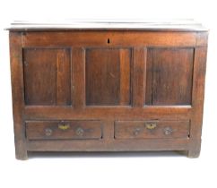 An 18th century and later large oak coffer with stile supports and two lower drawers, 88 x 124 x