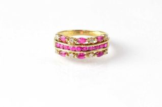 A 9ct gold ring set with a central band of rubies, flanked by bands of alternating rubies and