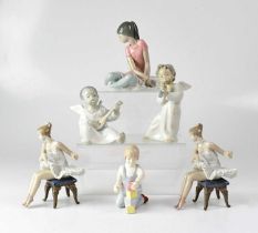 LLADRÓ; five figures comprising a pair of ballerinas with lace tutus, a seated ballerina, two