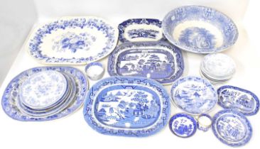 A quantity of 19th century blue and white transfer printed pottery, mostly Willow pattern or