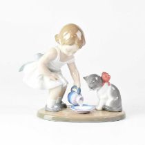 LLADRÓ; a boxed figure group of a young girl pouring milk into a saucer, with a seated cat looking