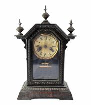 JUNGHANS; an early 20th century oak cased mantel clock, the silvered dial set with Roman numerals,