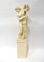 A contemporary plaster sculpture of a scantily clad young lady, mounted on a plinth base, height