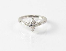 A platinum ring set with a marquise cut diamond, with diamond set shoulders, in claw settings,