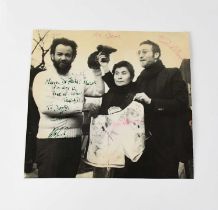 JOHN LENNON; a black and white promotional photograph bearing the signatures of John Lennon, Yoko