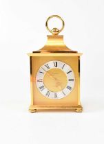 BUCHERER; a brass cased carriage-type clock, with wind-up mechanism, height 18cm. Condition