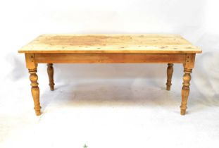 A pine kitchen table with rectangular top and single drawer, on baluster turned legs, 77 x 183 x