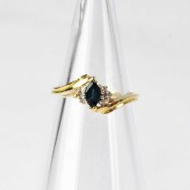 A 14ct gold sapphire and diamond set ring on twist shoulders, stamped '14K', size L1/2, approx. 2.