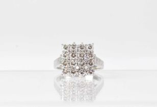 An 18ct white gold diamond cluster ring, with four approx. 0.1ct diamonds within a border of
