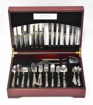 A quantity of Guy Degrenne stainless steel cutlery for six place settings, with extra items,