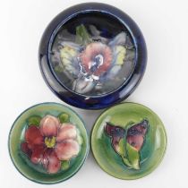 MOORCROFT; three tube-lined small cabinet dishes, comprising an 'Arum Lily' pattern pin dish,