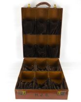 A large vintage brown leather shoe salesman's sample case, enclosing twelve sections with