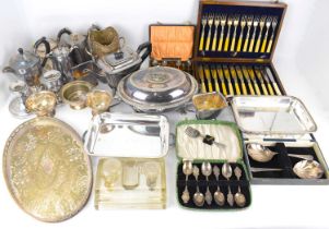 A quantity of silver plated items, to include a pair of short candlesticks, three-piece tea sets,