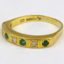 An 18ct gold diamond and emerald half eternity ring, size P, approx. 3.4g.