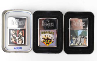 ZIPPO; three 'The Beatles' collectors' lighters, each with colour printed scenes to the front, in