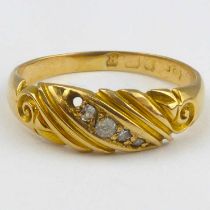 A vintage 18ct gold ring with a diagonal row of diamonds, size M, approx. 2.9g.