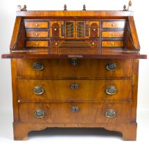 A Regency and later mahogany fall-front bureau with galleried top and acorn finials, the fitted