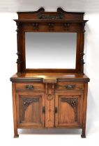 An Edwardian mahogany mirror back sideboard, with Art Nouveau carving, reeded columns and brass