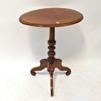 A Victorian mahogany oval-topped occasional table on turned column and tripod base, 71 x 60 x 43cm.