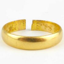 A 22ct gold wedding band, size N, approx. 3.9g. Condition Report: - The ring has been cut and the