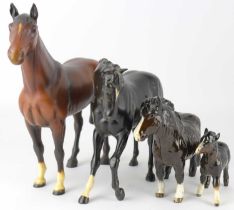 BESWICK; four model horse figures comprising 'Black Beauty' 2466 or H2466, 'The Winner' 2421,