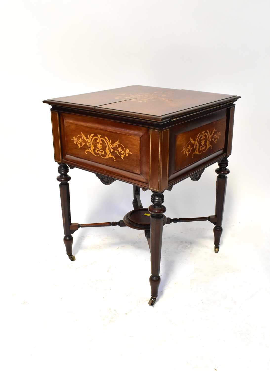 An early 19th century rosewood and floral marquetry inlaid 'Eclipse' drinks cabinet, the moulded