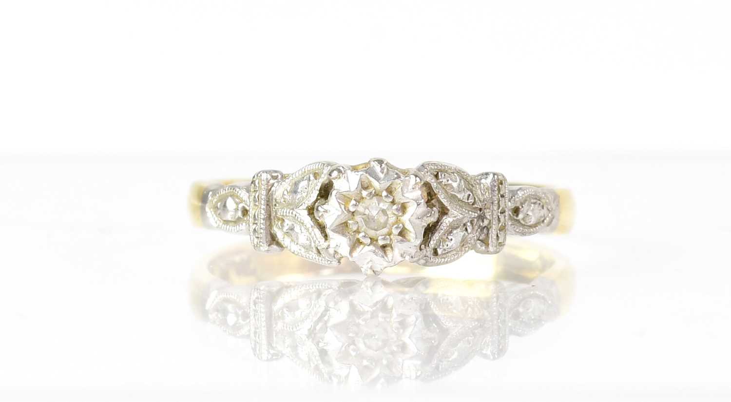 Four 18ct gold rings variously set with diamonds, chip diamonds, white stones and a tiny blue stone,