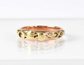 A 9ct rose gold ring with yellow gold decoration, size P, approx. 3.2g.
