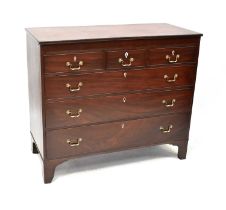 A George III mahogany chest of three short and three long graduated drawers, with secret drawer